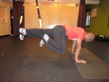 trx standing plank roll out