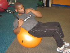 stability ball oblique crunches with a cable
