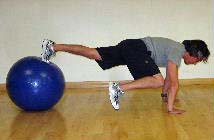 ball plank with frog kicks