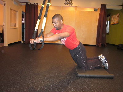 trx kneeling plank roll out for obliques to the left