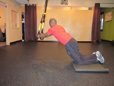 trx kneeling plank roll out for obliues to the right