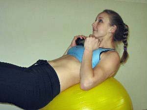 dumbbell crunches on a stability ball
